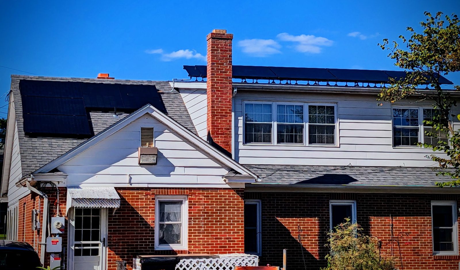 All-black solar panels installed by Shore Home and Solar on a Maryland brick home